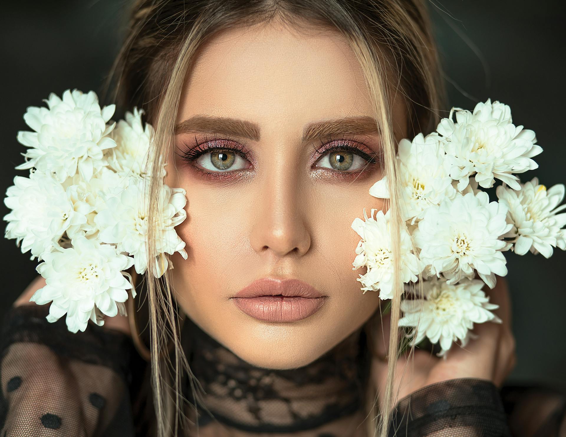 woman flowers next to face