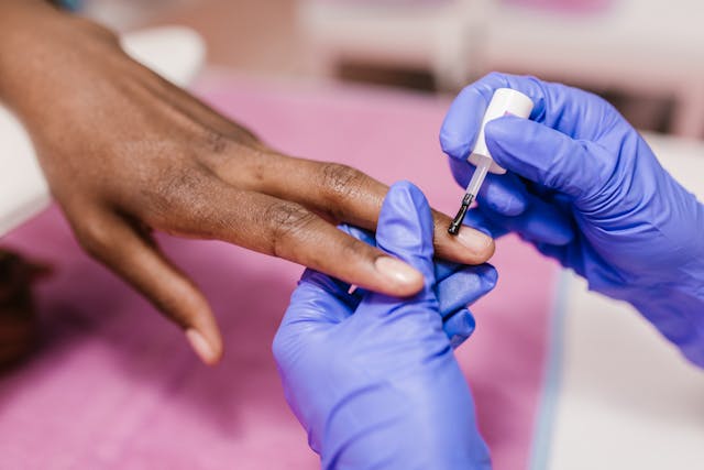 woman getting manicure